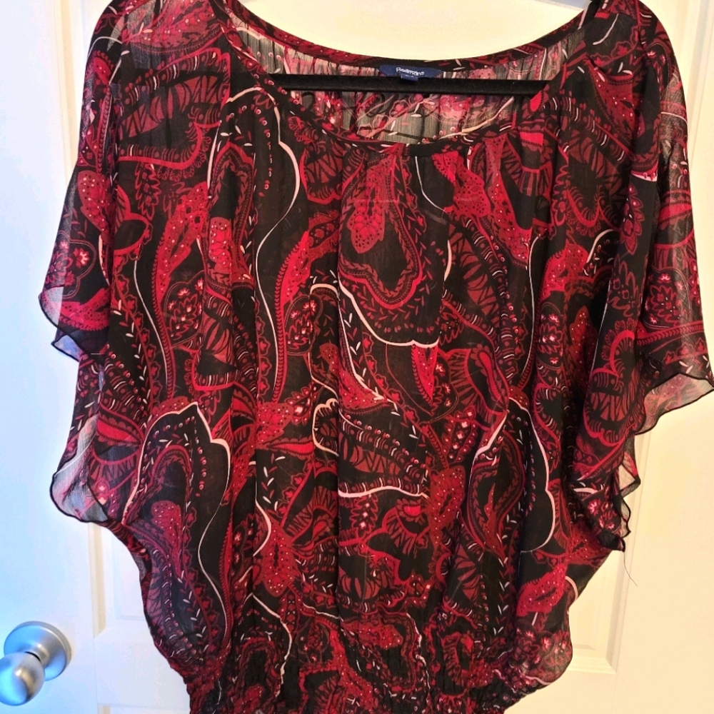 Reitems red patterned sheer blouse.